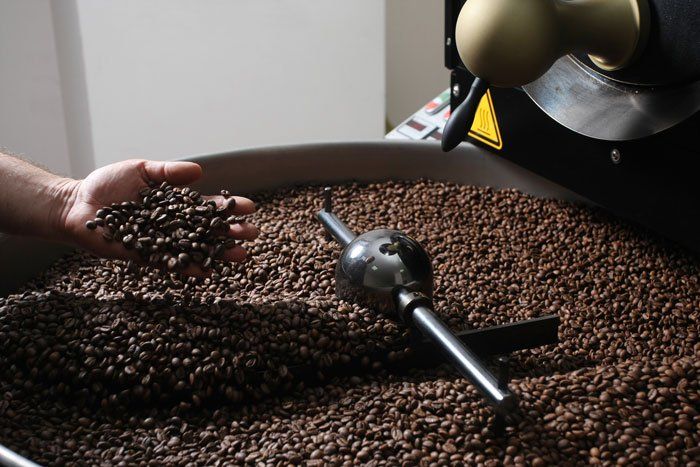 Roasting coffee beans in the middle of the store