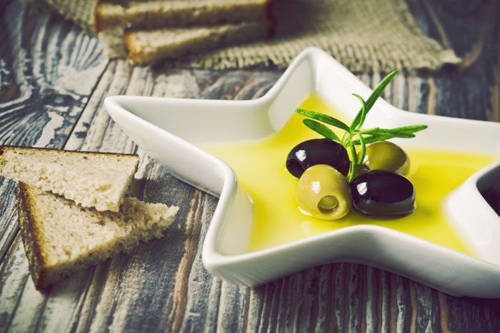 Olive oil in star shaped bowl.